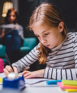 Girl drawing at night cropped